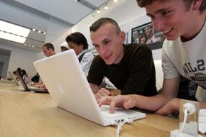 Customers at the Apple store in San Francisco try out the original MacBook back in 2006.