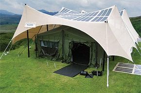 A 2kW PowerShade made by PowerFilm. Note the shelter's amorphous-silicon photovoltaic panels integrated directly in the shelter's fabric. One structure could produce about 10 kW per day.