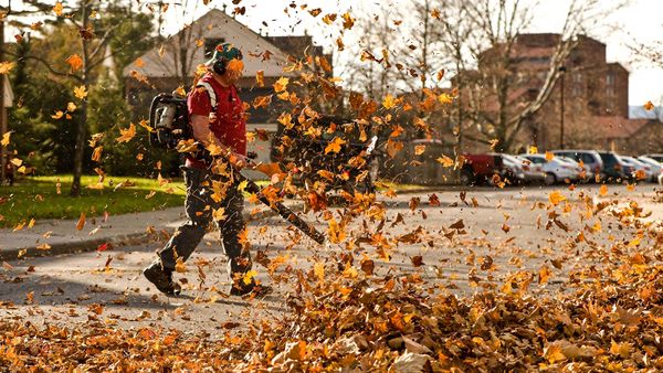 man using leaf blower