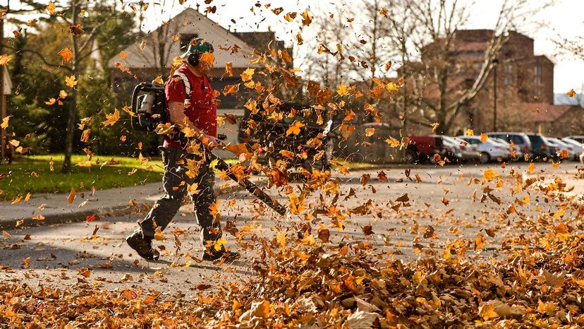 man using leaf blower