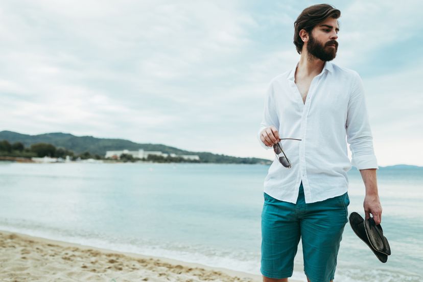 Young man walking on the beach