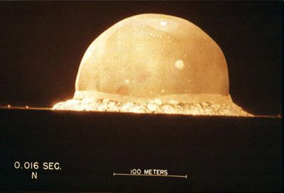 A photograph shows the first atomic bomb test on July 16, 1945, at 5:30am, at the Trinity Site in New Mexico.