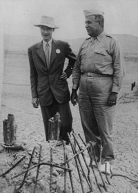 Nuclear physicist Robert Oppenheimer, left, with Major General Leslie Groves, by the remains of the tower from which an atom test bombwas ignited.