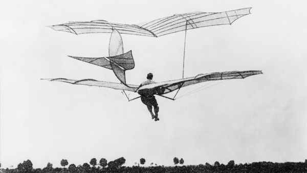 Men flying in black and white sport propeller.