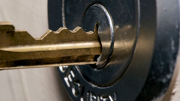 A master key entering a door lock
