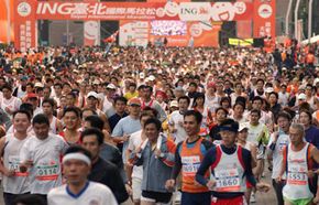 Runners compete in the Taipei International Marathon, Dec. 17, 2006. One great reason to marathon? To travel the world! See more Olympic pictures.