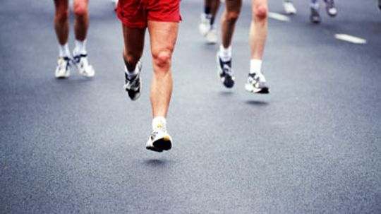 Why can a trained athlete run a marathon, but a couch potato cannot run half a mile?