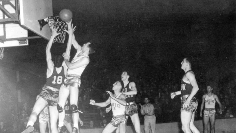 Ohio State center John Schick makes a basket during the first NCAA Men's Basketball National Championship game held in Evanston, Illinois in 1939. Oregon defeated Ohio State 46-33 to win the first title. NCAA Photos via Getty Images