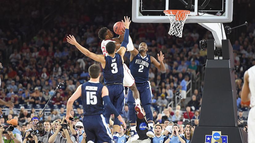Kris Jenkins, No. 2 of the Villanova Wildcats, blocks the shot of Buddy Hield, No. 24 of the Oklahoma Sooners, during the 2016 NCAA Men's Final Four Semifinal Championship game at the NRG Stadium in Houston. Mitchell Layton/Getty Images