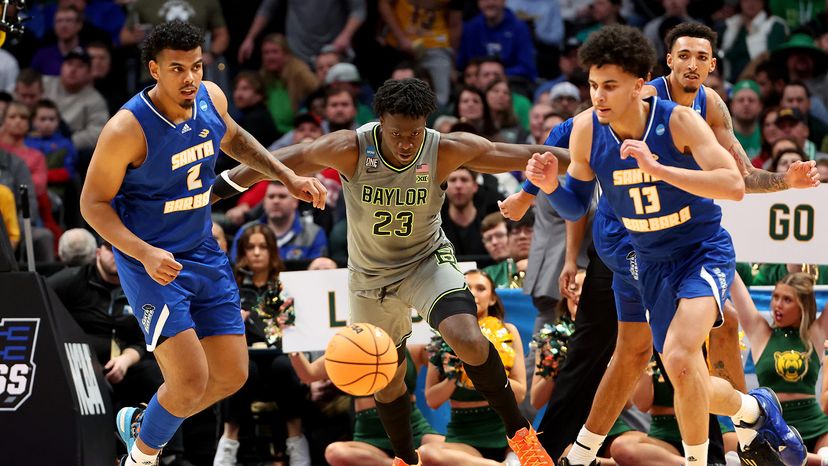 Jonathan Tchamwa Tchatchoua, No. 23 of the Baylor Bears, races after a loose ball against the UC Santa Barbara Gauchos during the first round of the 2023 NCAA Men's Basketball Tournament (aka March Madness) held at Ball Arena on March 17, 2023, in Denver. Justin Tafoya/NCAA Photos via Getty Images