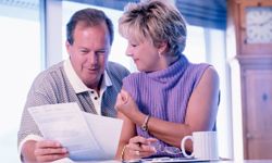 couple looking at financial statements