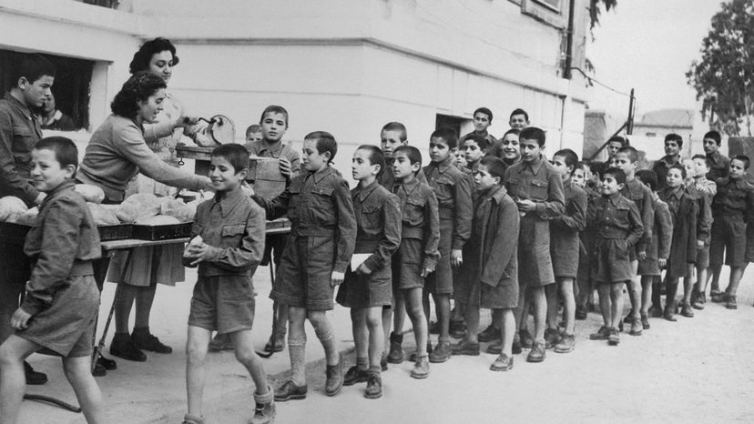 Children in Greece line up for bread