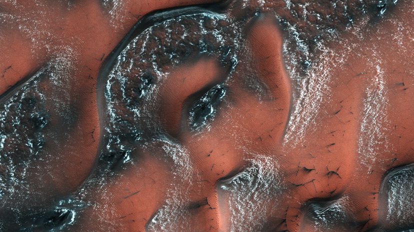 overhead shot of dunes on martian surface covered with snow