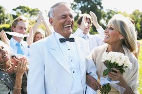 mature bride and groom laughing