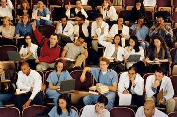 Medical students in lecture hall. 