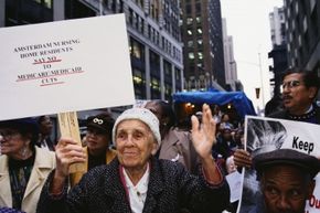 Medicaid’s funding has long been a hot-button political issue. In this 1995 photo, an elderly woman protests cuts to Medicare and Medicaid at a health care march and rally in New York City.