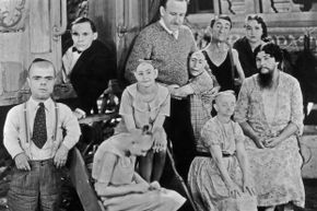 Often, sideshows paraded mental disabilities as acts. Here, director Tod Browning poses with the cast of his circus film, &quot;Freaks.&quot;