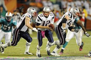 New England Patriots quarterback Tom Brady (12) during a game against the Miami Dolphins on Oct. 4, 2010, in Miami.