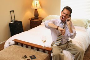 tired businessman in hotel room
