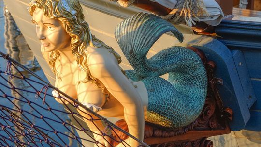 Why are mermaids on ships' prows considered good luck?