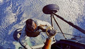 Alan Shepard during recovery (top) and on-board the carrier after his flight