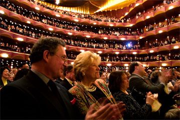 The audience gives a standing ovation for the Metropolitan Opera's closing night performance of the opera "Tosca" by Giacomo Puccini, in New York City, on May 11, 2002.