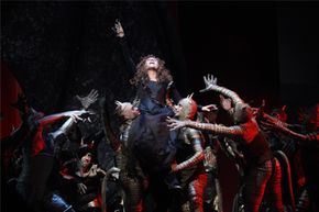 In this April 9, 2010 photo, Renee Fleming, center, performs the title role during the final dress rehearsal of Gioachino Rossini's "Armida" at the Metropolitan Opera in New York.