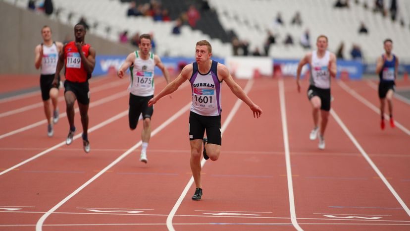 Runners in lanes on track