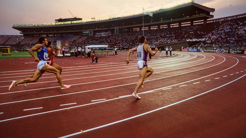 Runners in lanes on track