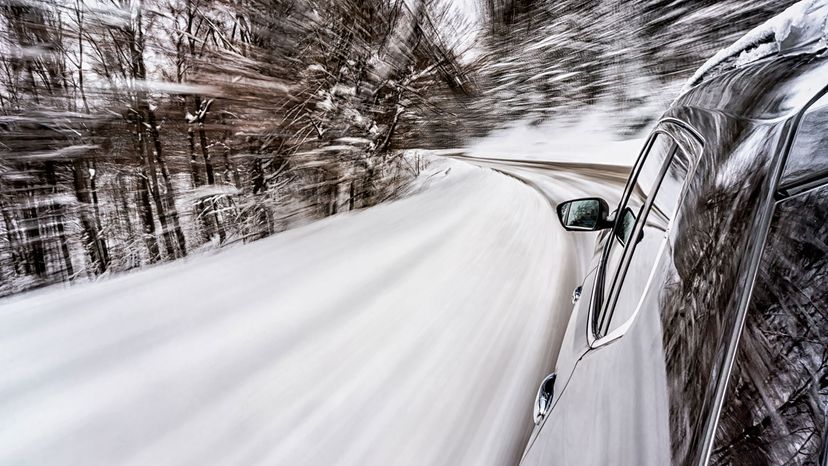 Motion blur shot of a ca car driving on a snowy road