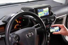 Once everything is all hooked up, you can use the buttons in the center console and even the buttons on the steering wheel to control your phone.