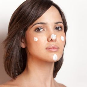 Woman with facial cream on.