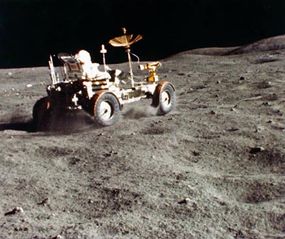 A 16mm film frame of astronaut John Young driving around the surface of the moon. Did NASA slow down footage of the moon landings to simulate weightlessness?
