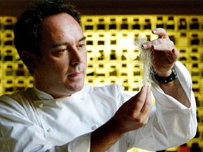 Chef&nbsp;Ferran Adrià holding yarn looking substance in hands