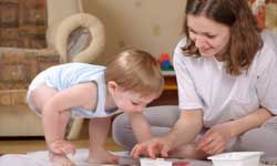 baby and mother fingerpainting