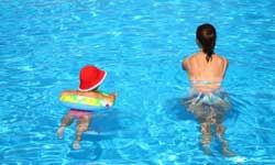 mother and baby in pool