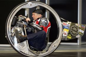 Kerry McLean on his monowheel motorbike at the Essen Motor Show fair in Essen, Germany.
