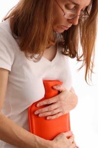 Many women may empathize with this woman suffering menstrual cramps.