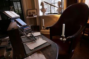 Jefferson's cabinet contains his trusty polygraph and important volumes.