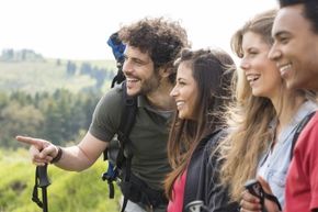 A group of friends looks at a landscape.
