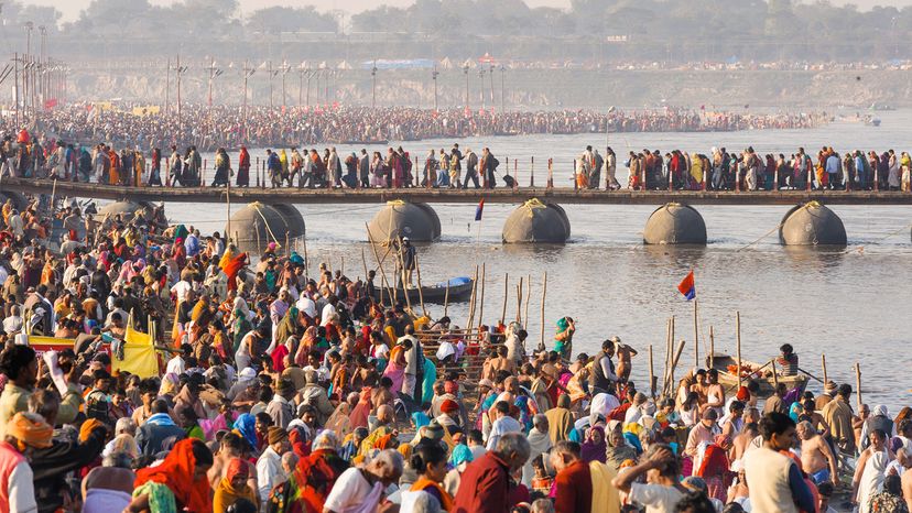 Religious pilgrims bathe in the Ganges River