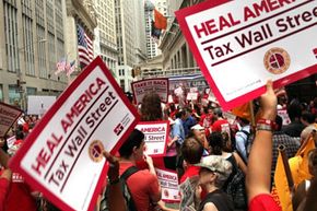 Members of the nurses' union, National Nurses United, march on Wall Street in June 2011 to protest income inequality. See more pictures of protests.