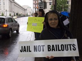 A protester opposes the federal bailouts of investment banks and mortgage buyers in Washington in September 2008.