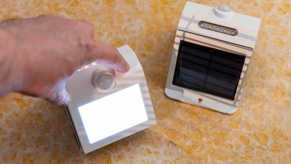 Two solar motion sensor lights