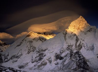 Storm clouds hug the summit pyramid of Mt. Everest.