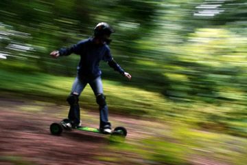 Mountain boards in wooded area.