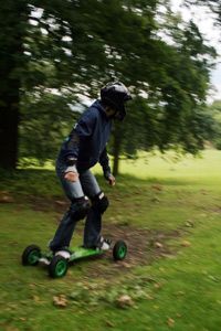 Mountain boarder in wooded area. 