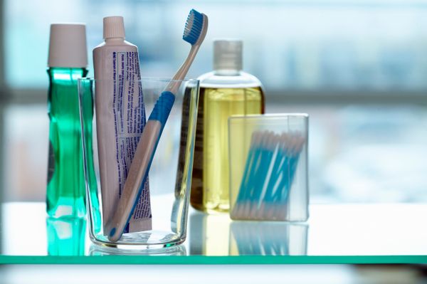 A display of mouthwash, toothbrushes and other oral hygiene instruments.