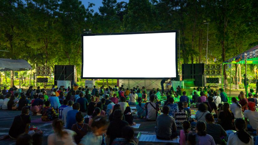 Spectators at Open-Air cinema summer night