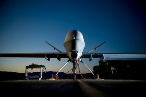 A picture of a drone plane parked on the ground.